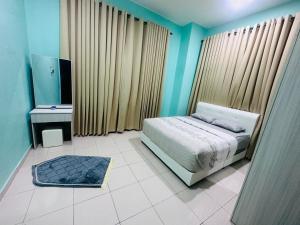 Ένα ή περισσότερα κρεβάτια σε δωμάτιο στο Xamella Homestay