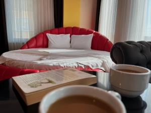 Postel nebo postele na pokoji v ubytování Ottoman Hotel Sakarya