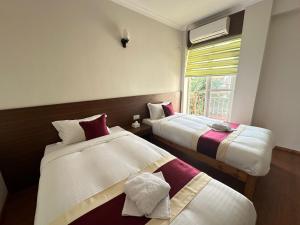 Postel nebo postele na pokoji v ubytování Hotel Sohum