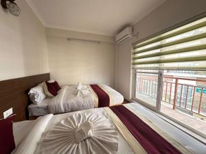 Postel nebo postele na pokoji v ubytování Hotel Sohum + 37 fotografií