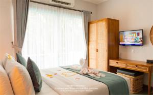 TV a/nebo společenská místnost v ubytování de'Govin Hotel