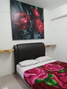 Postel nebo postele na pokoji v ubytování Rose Haven Hotel