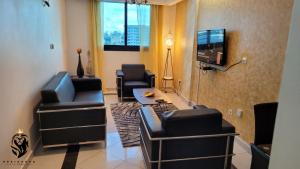 TV a/nebo společenská místnost v ubytování Residence Le Carat