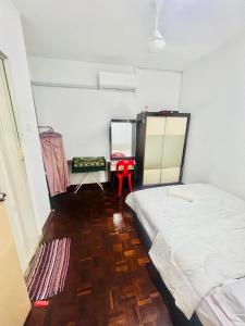 Postel nebo postele na pokoji v ubytování Country Homestay KK