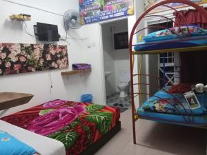 Postel nebo postele na pokoji v ubytování Rose Haven Hotel