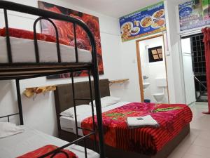 Postel nebo postele na pokoji v ubytování Rose Haven Hotel