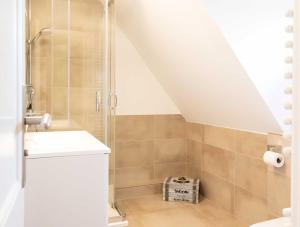 a bathroom with a shower and a sink at Alt Westerland Hüs in Westerland (Sylt) +23 photos