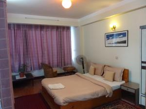 Hotel Pristine客房内的一张或多张床位
