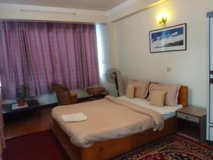 Hotel Pristine客房内的一张或多张床位