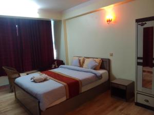 Hotel Pristine客房内的一张或多张床位