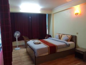 Hotel Pristine客房内的一张或多张床位