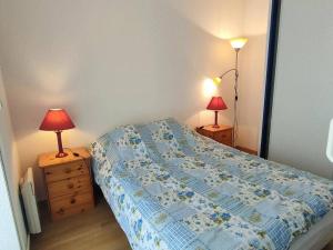 Ένα ή περισσότερα κρεβάτια σε δωμάτιο στο Appartement 2 pièces au centre de Cauterets - FR-1-234-148