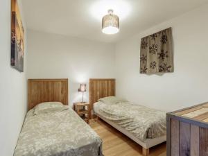 Postel nebo postele na pokoji v ubytování Appartement ski aux pieds, 2 chambres, parking couvert inclus - FR-1-352-4