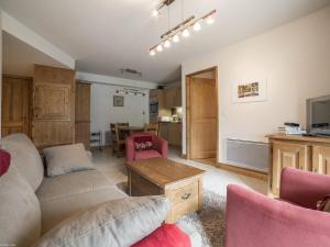 Et tv og/eller underholdning på Appartement 3 pièces ski aux pieds, parking, internet inclus - FR-1-352-2