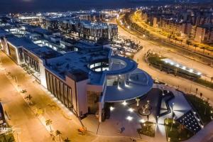 an overhead view of a city at night at Our home Our heaven in Madinaty