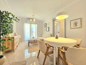 a living room with a table and a living room with a couch at Our home Our heaven in Madinaty +13 photos