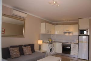 Kuchyňa alebo kuchynka v ubytovaní El Piso del Puerto - Charm Apartment + 27 fotografií