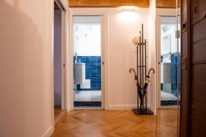 a hallway with a doorway with a glass door at Costaguti Holiday Apartment in Rome