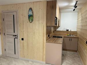 Kuchyň nebo kuchyňský kout v ubytování Міні Готель SPA Excellent Family
