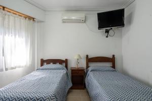 Postel nebo postele na pokoji v ubytování Hosteria Recalada