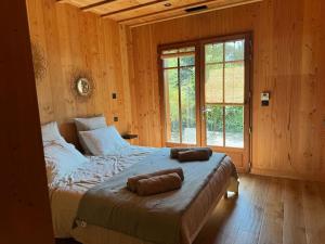 Ένα ή περισσότερα κρεβάτια σε δωμάτιο στο La kabane de Manou, maison de charme Cap Ferret