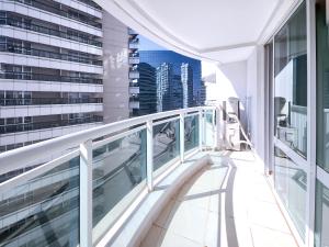 a balcony with a view of a city at Flat Particular - Centro de Brasília - 9º Andar in Torto