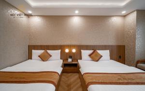 Postel nebo postele na pokoji v ubytování Nét Việt Hotel Vincom Sóc Trăng