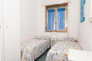 Posteľ alebo postele v izbe v ubytovaní Villa Jonny a due passi dal Mare