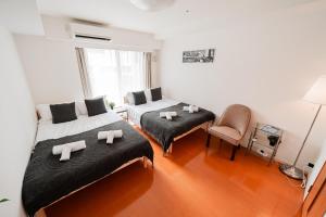 Lova arba lovos apgyvendinimo įstaigoje Shinjuku luxury Apart ment 2 minutes from Higashi-Shinjuku