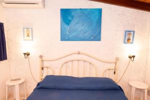 Posteľ alebo postele v izbe v ubytovaní Villa Jonny a due passi dal Mare