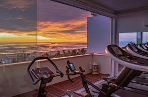 a gym with a view of the ocean at Hotel Cristallo in Giulianova