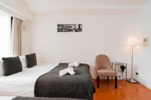 Lova arba lovos apgyvendinimo įstaigoje Shinjuku luxury Apart ment 2 minutes from Higashi-Shinjuku