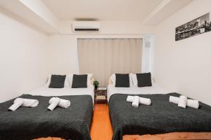 Lova arba lovos apgyvendinimo įstaigoje Shinjuku luxury Apart ment 2 minutes from Higashi-Shinjuku