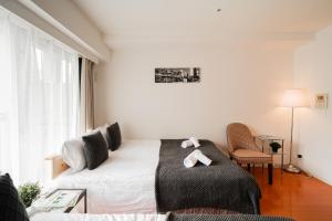 Lova arba lovos apgyvendinimo įstaigoje Shinjuku luxury Apart ment 2 minutes from Higashi-Shinjuku