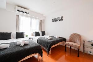 Lova arba lovos apgyvendinimo įstaigoje Shinjuku luxury Apart ment 2 minutes from Higashi-Shinjuku
