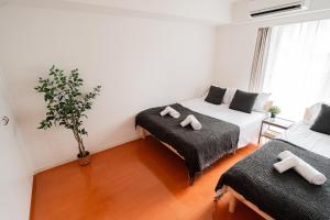 Lova arba lovos apgyvendinimo įstaigoje Shinjuku luxury Apart ment 2 minutes from Higashi-Shinjuku