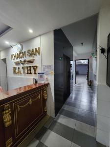 a restaurant lobby with a counter and a hallway at Kathy Hotel in Ho Chi Minh City