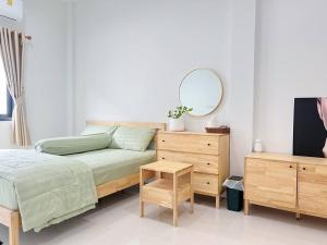 เตียงในห้องที่ บ้านคุณหมวย Bannkhunmuay +32 ภาพ