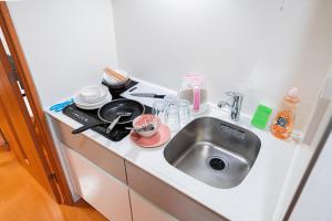 Virtuvė arba virtuvėlė apgyvendinimo įstaigoje Shinjuku luxury Apart ment 2 minutes from Higashi-Shinjuku