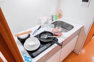 Virtuvė arba virtuvėlė apgyvendinimo įstaigoje Shinjuku luxury Apart ment 2 minutes from Higashi-Shinjuku