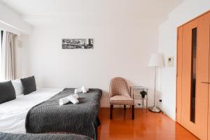Lova arba lovos apgyvendinimo įstaigoje Shinjuku luxury Apart ment 2 minutes from Higashi-Shinjuku