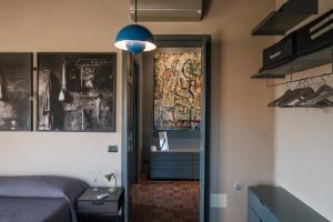 a bedroom with a bed and a blue light at Podere San Pasquale in Castiglione dʼOrcia