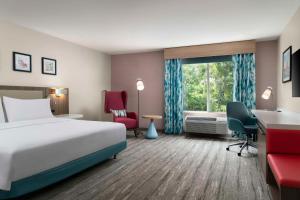 a hotel room with a bed and a window at Hilton Garden Inn Kennett Square in Kennett Square +27 photos