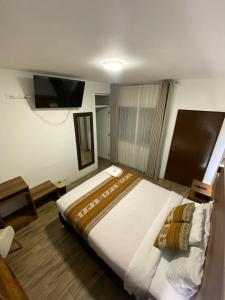 Postel nebo postele na pokoji v ubytování Hotel Rumi