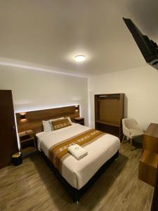 Postel nebo postele na pokoji v ubytování Hotel Rumi