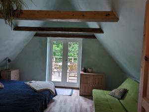 Postel nebo postele na pokoji v ubytování Lejlighed ved skov