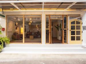 a sliding glass door of a house with a living room at 2-Bedroom Penthouse in the heart of Silom - 4A in Bang Rak