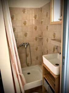 a bathroom with a shower and a tub and a sink at Charmant séjour au cœur des vignes de Banyuls in Banyuls-sur-Mer +59 photos