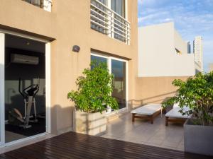 a balcony with a view of a building at Two Independent Palermo Hollywood Studios at Buenos Aires's Best Neighborhood in Buenos Aires