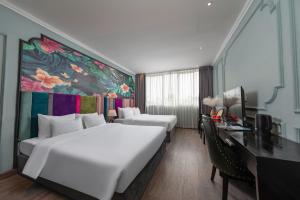 Postel nebo postele na pokoji v ubytování Madelise Amica Hotel and Travel + 29 fotografií